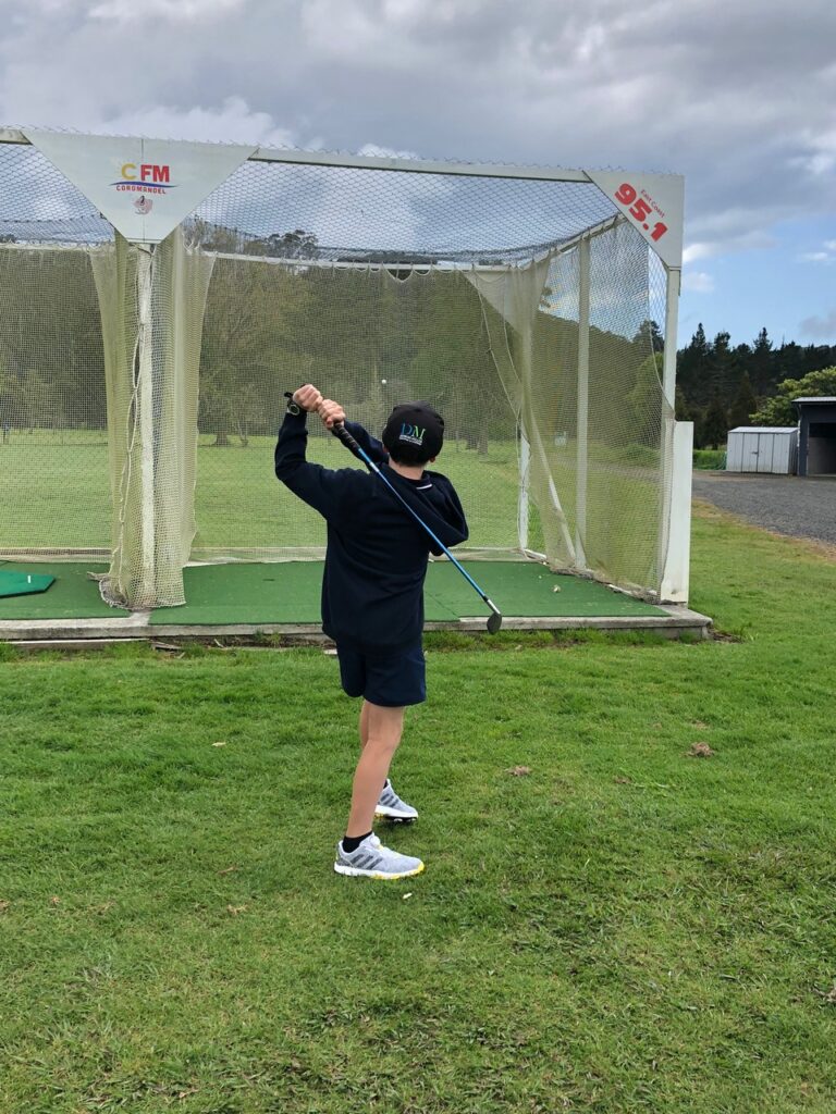 Caleb playing Golf in Coromandel Aotearoa - Whitianga with cfm advertise in Coromandel