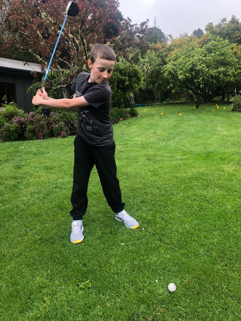 Caleb playing Golf in Coromandel Aotearoa - Whitianga